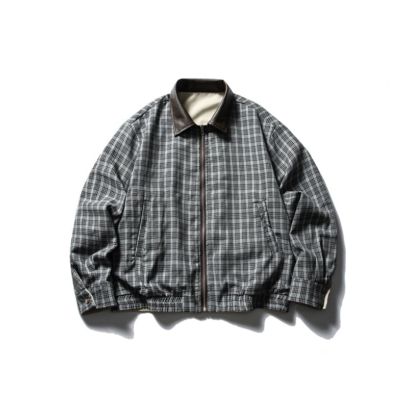 Front view of a gray and black plaid zip-up jacket with a dark collar, angled pockets, and elasticized hem.