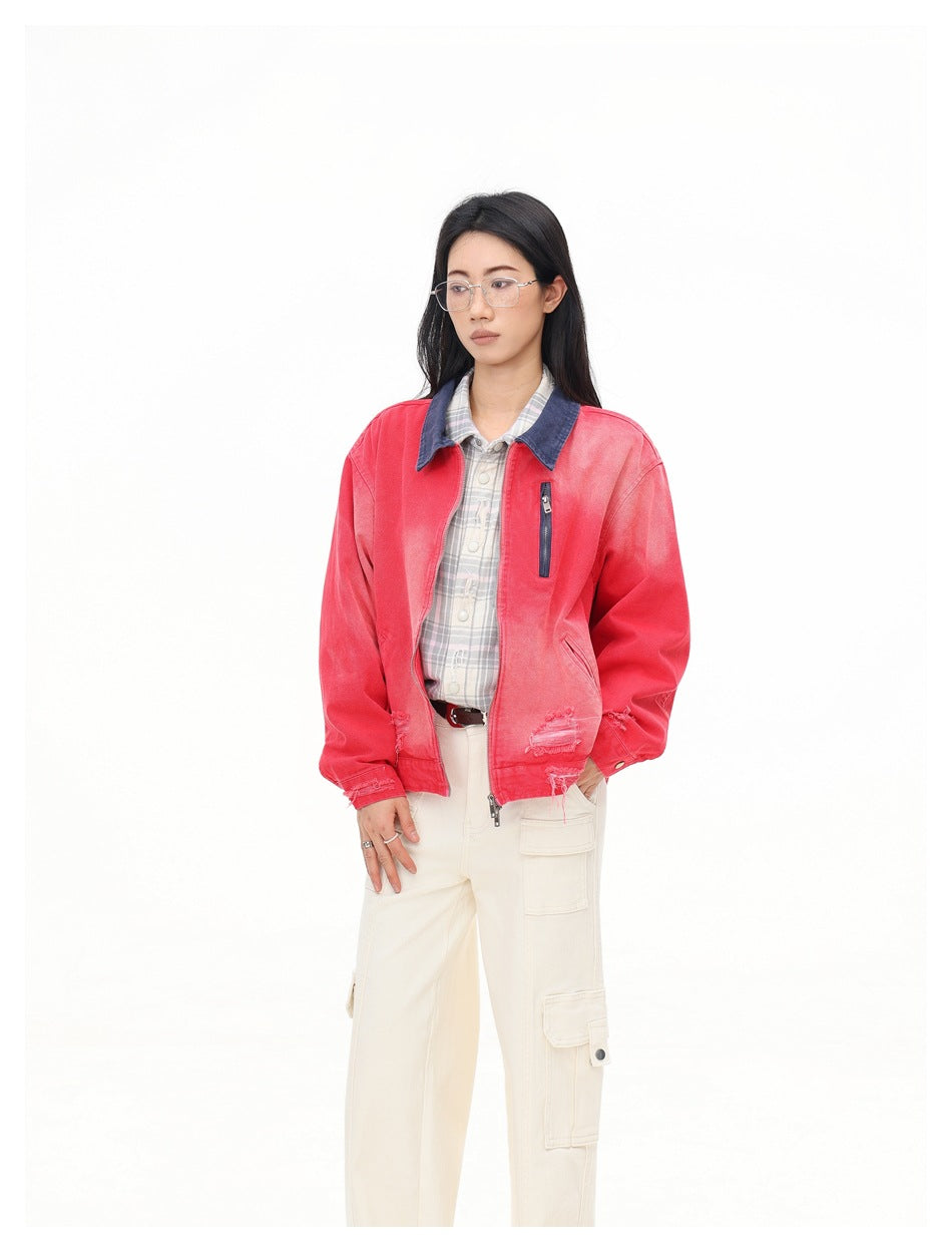 Three-quarter view of a model wearing a faded red jacket with a dark blue collar and distressed hem.