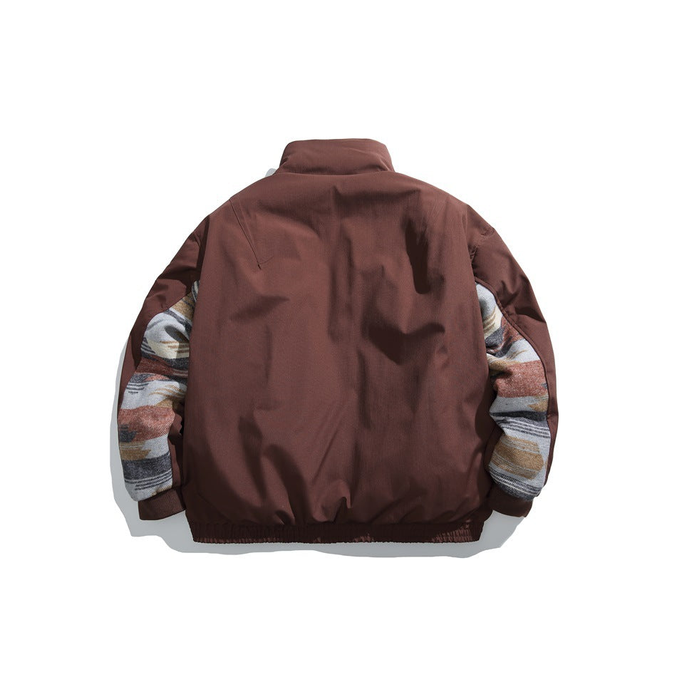 Back view of a burgundy jacket with contrasting multicolor patterned sleeve panels and a gathered hem.