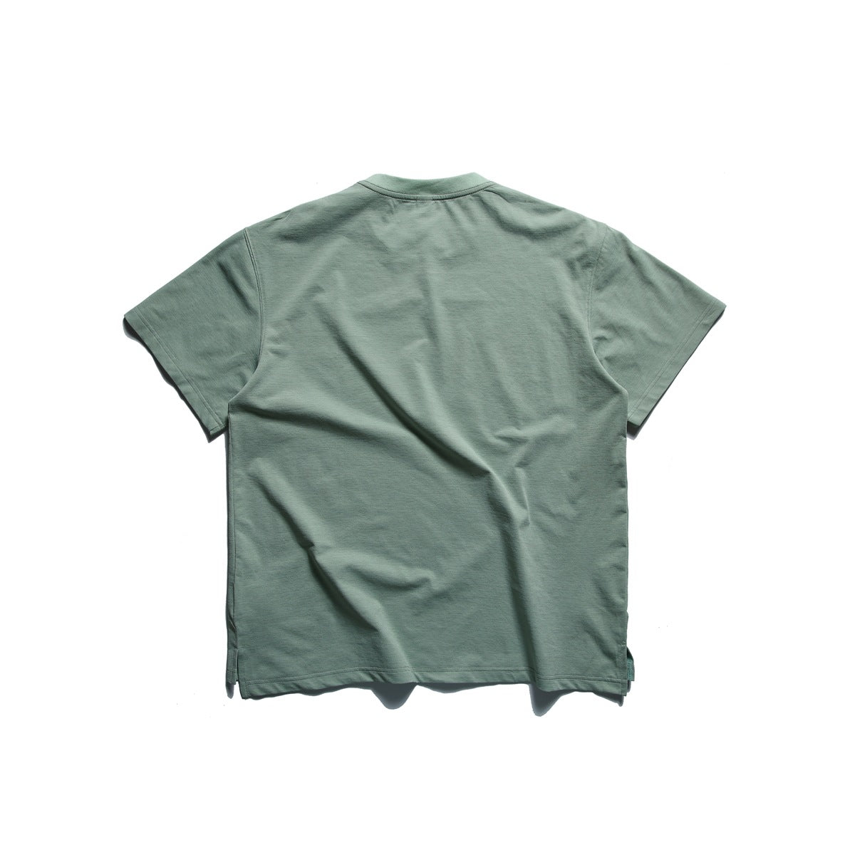 Back view of a plain sage green short-sleeve crew-neck T-shirt on a white background.