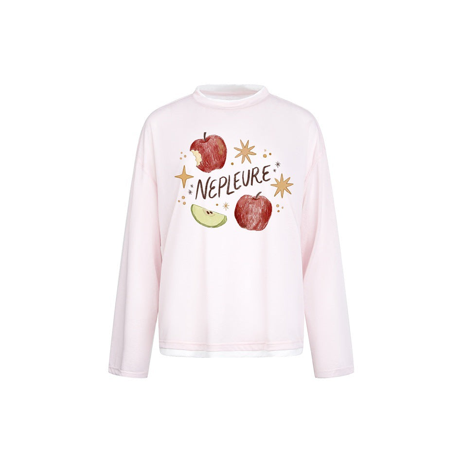 Light pink long-sleeve tee with white layered collar and hem and an apple and stars graphic on the front