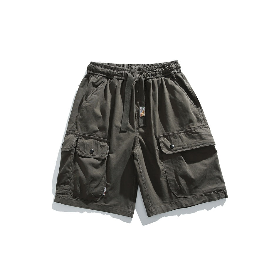 Dark olive-gray cargo shorts flat lay with elastic drawstring waist and snap flap cargo pockets
