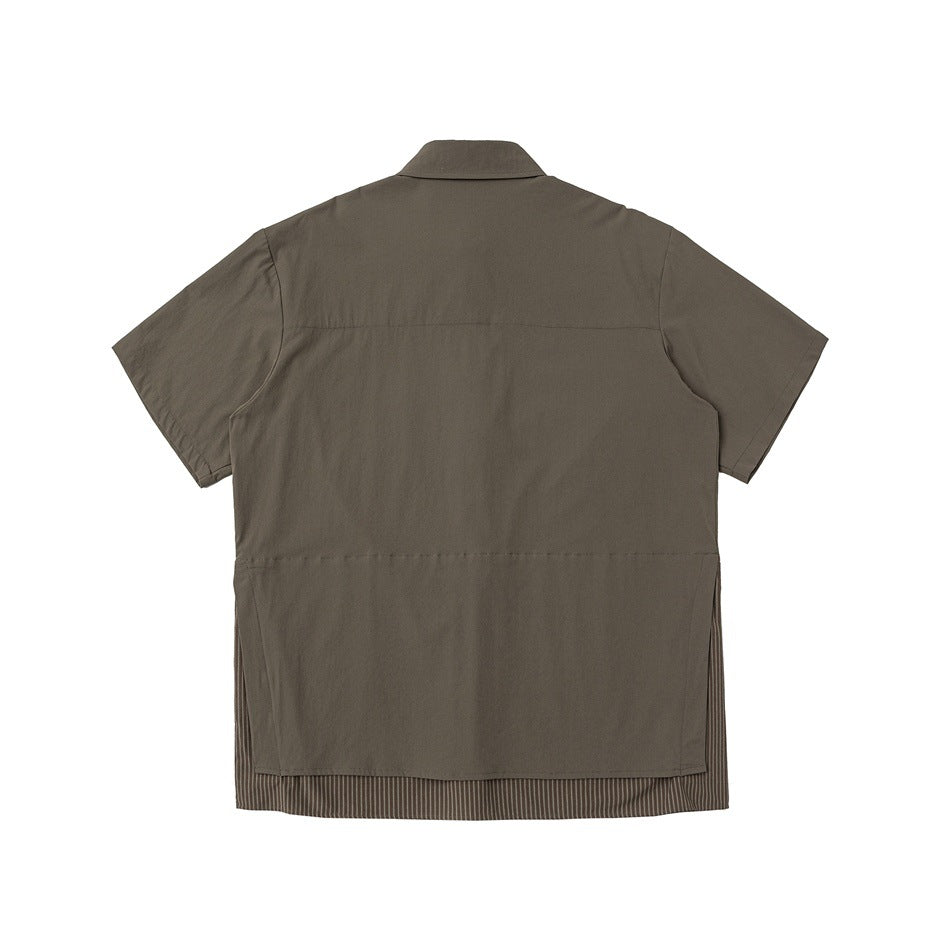 Back view of a dark olive-brown short-sleeve shirt with a striped inset visible along the hem.