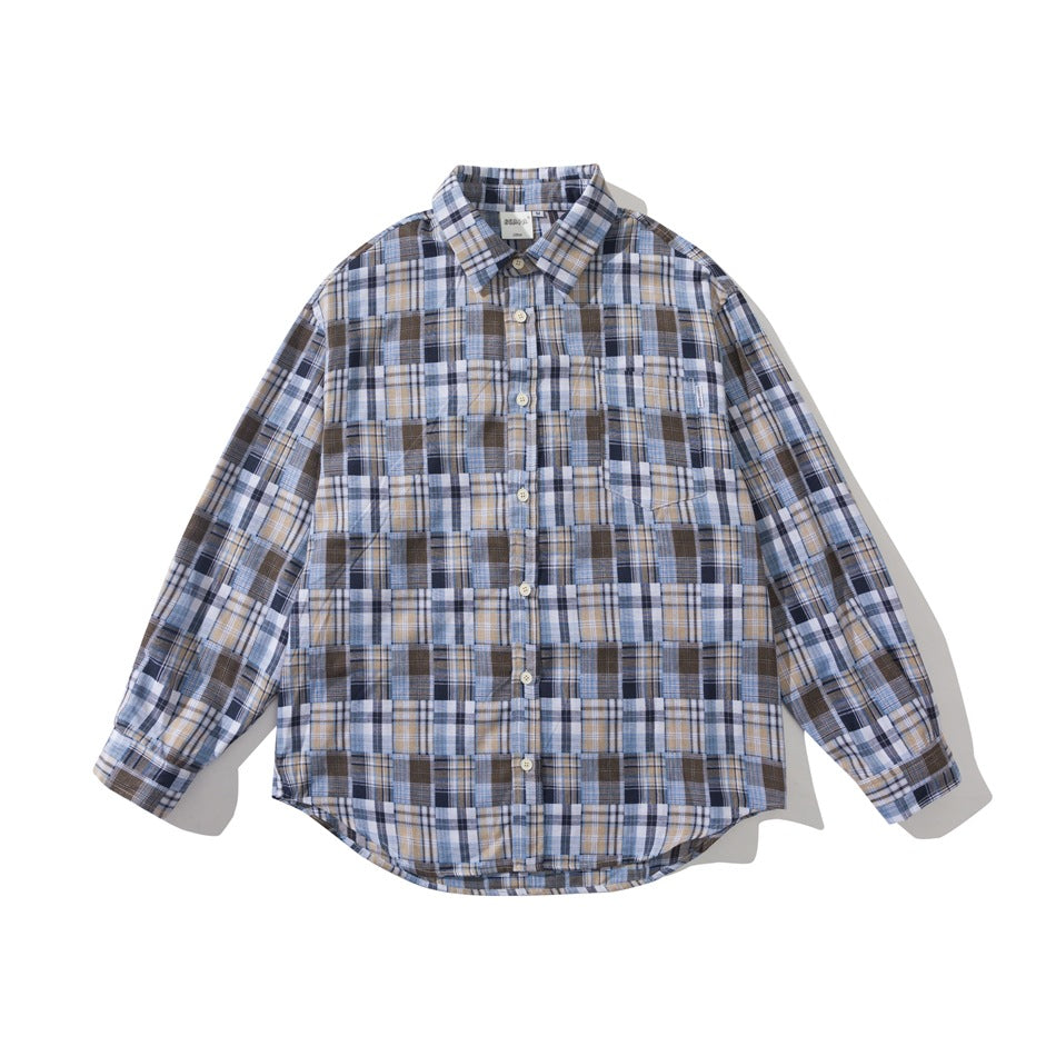Blue patchwork plaid long-sleeve button-up shirt, flat lay front view with chest pocket and pointed collar