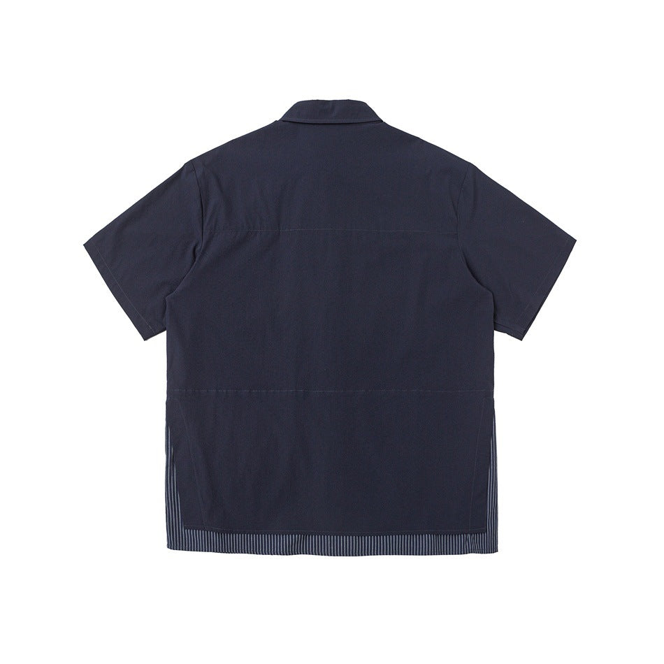 Back view of a navy short-sleeve shirt with a narrow striped inset along the hem.