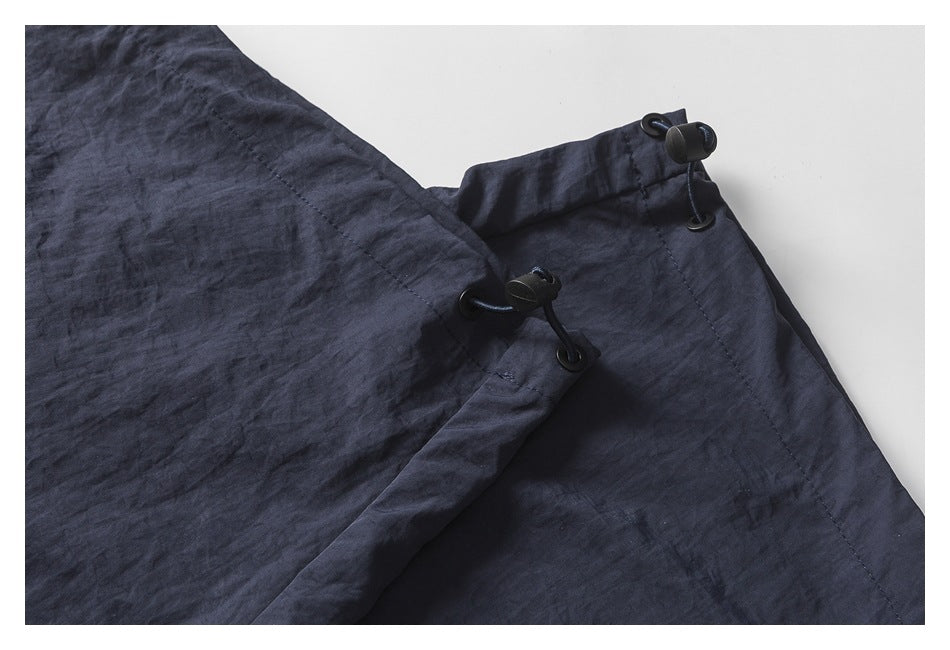 Close-up of the pants' leg opening with adjustable drawcord toggles.