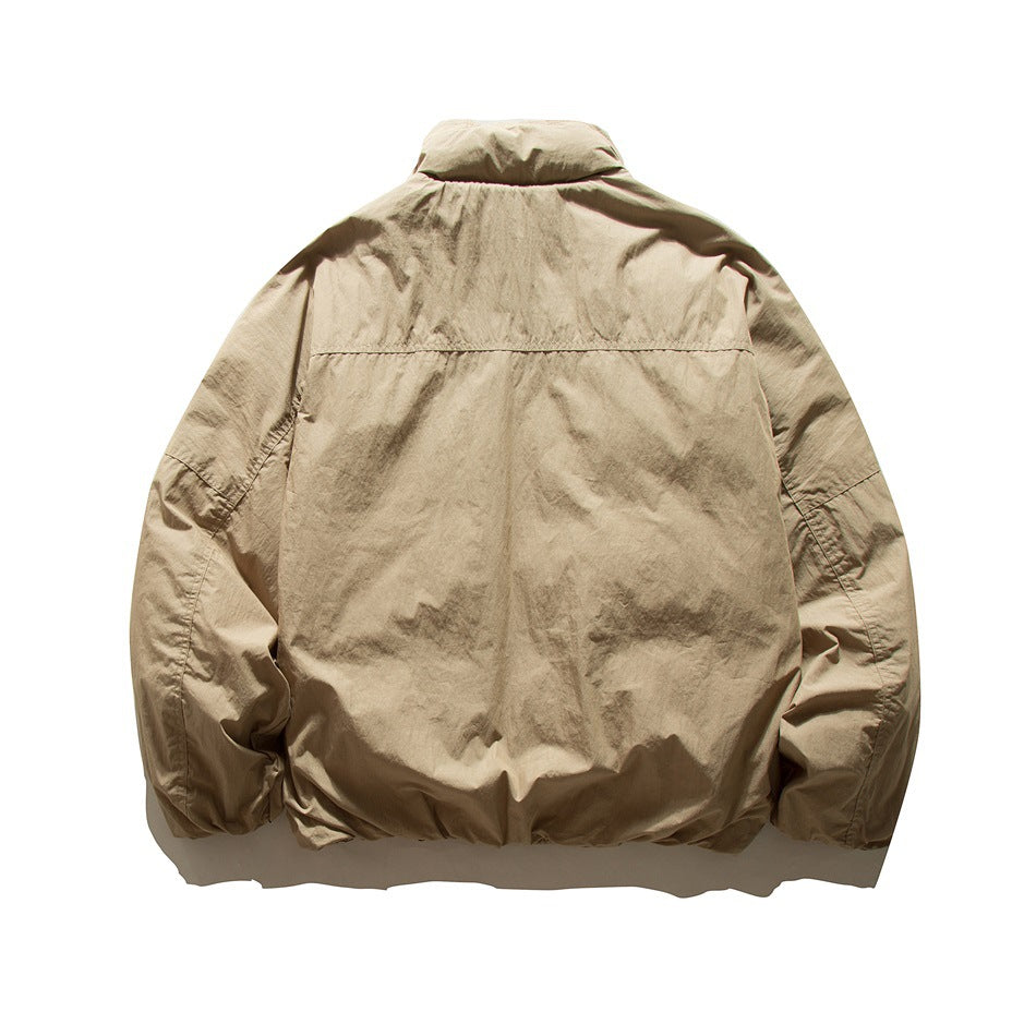 Back view of khaki padded jacket with stand collar, yoke seam and raglan sleeves