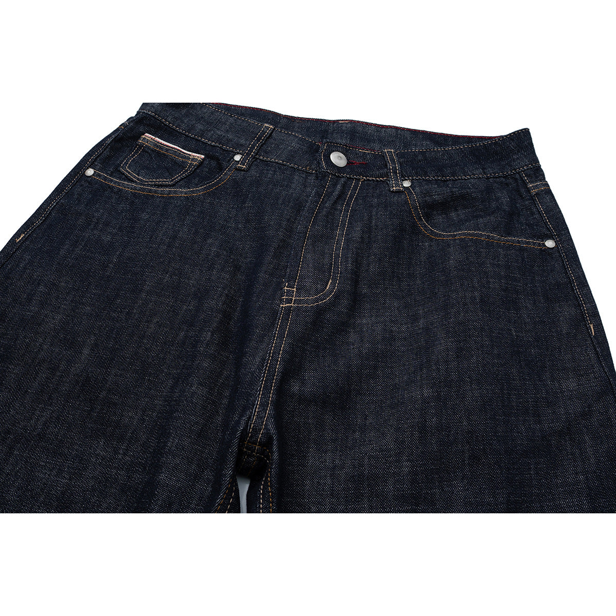Close view of dark indigo jeans from the front, showing the waistband, button, coin pocket and front pockets.