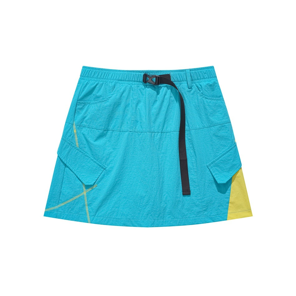 Teal mini skirt with black buckle belt, flap pockets, yellow side panel and yellow topstitching