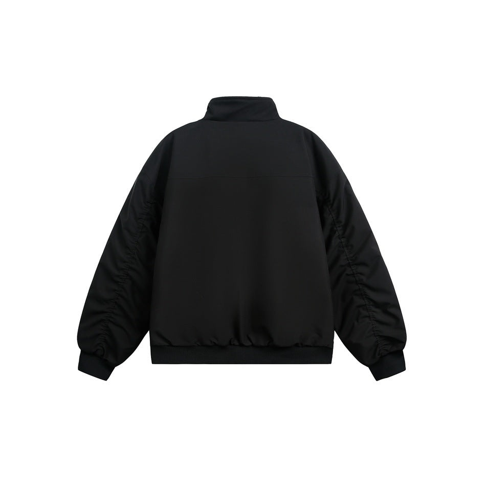 Black stand-collar jacket back view with yoke seam, ruched sleeves and ribbed hem, flat lay