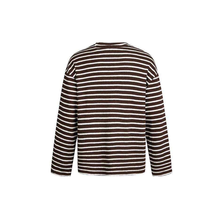 Back view of a long-sleeve sweater with narrow white stripes on a brown background.