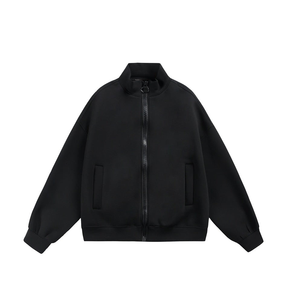 Black stand-collar zip jacket flat lay, front view with large zipper, welt pockets and ribbed cuffs