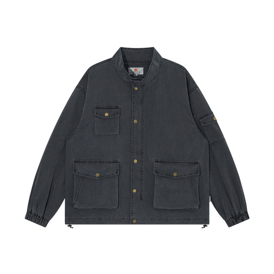 Dark gray washed stand-collar jacket flat lay with snap front, flap pockets, elastic cuffs and drawstring hem