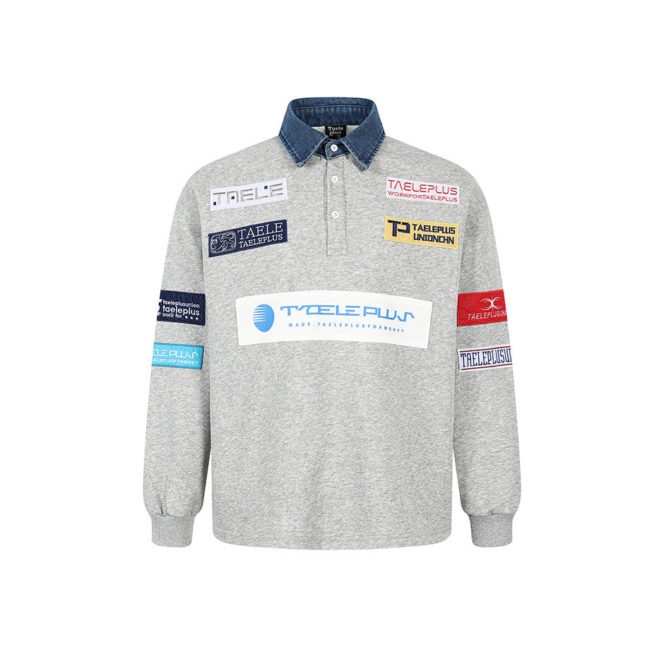 Heather gray long-sleeve pullover with blue denim-look collar, button placket and colorful embroidered patches, front view
