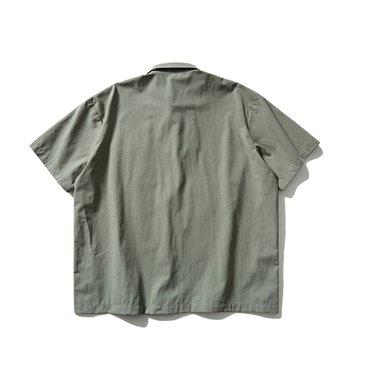 Back view of a muted gray-green short-sleeve button-up shirt with a collar.