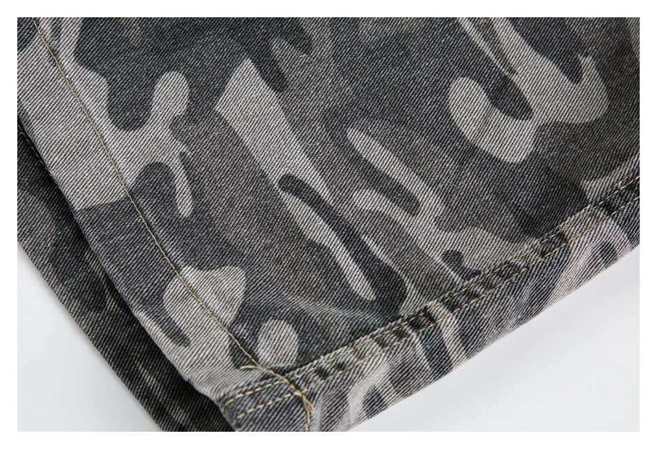 Close-up of the gray camouflage denim pants’ leg and double-stitched hem.