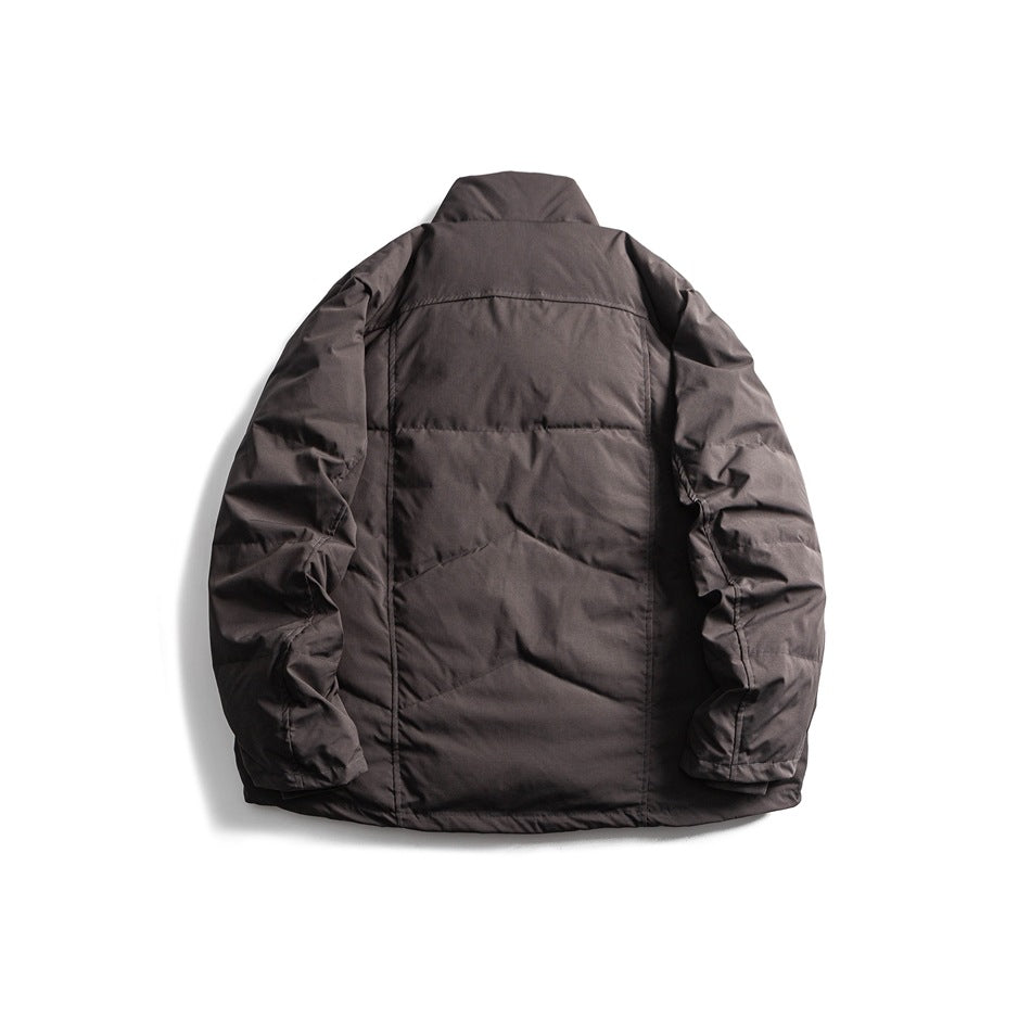 Back view of a charcoal gray padded jacket with a raised collar and long sleeves.