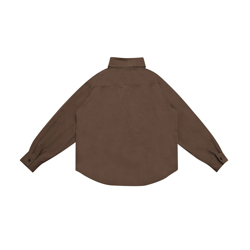 Back view of brown long-sleeve shirt flat lay with yoke seam, buttoned cuffs and curved hem