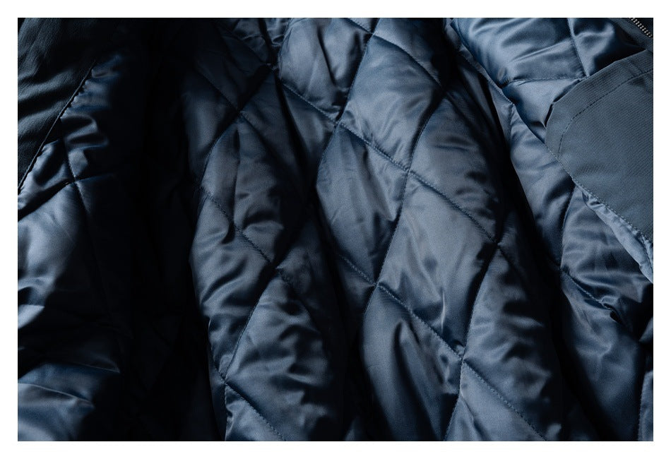 Close-up of the dark navy jacket's shiny diamond-quilted lining.