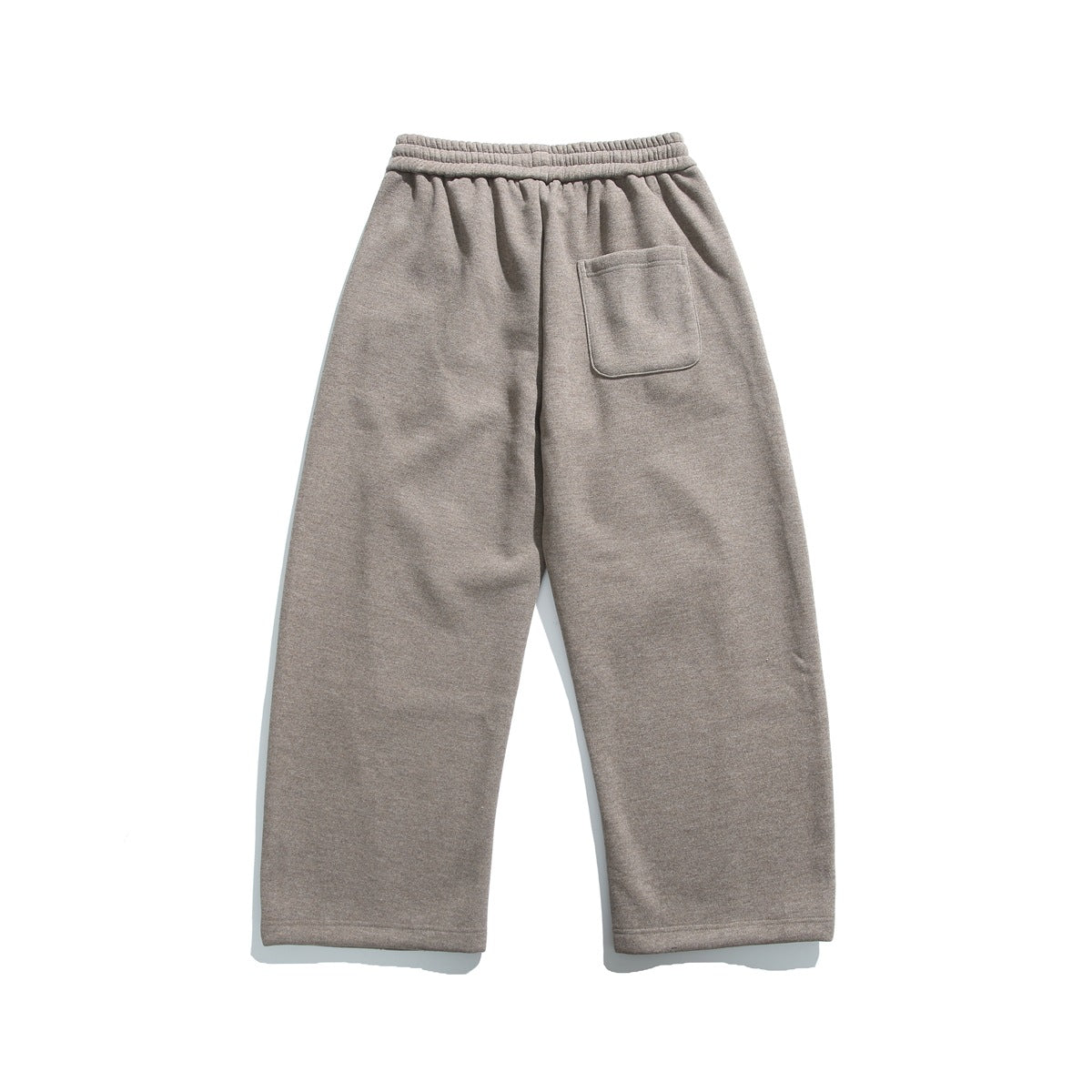 Back view of coffee brown wide-leg pants with elastic waistband and a single patch pocket