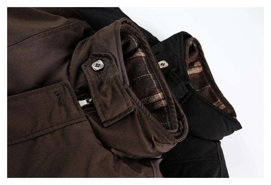 Close-up of brown and black jackets showing plaid lining, collar tabs, buttons and a front pocket.