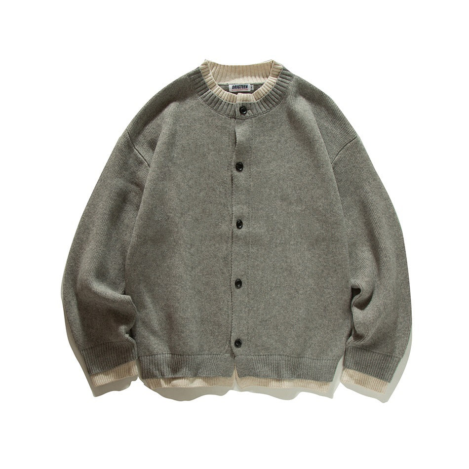 Gray knit button-front cardigan with crew neck and cream ribbed trim at collar, cuffs and hem, flat lay front view