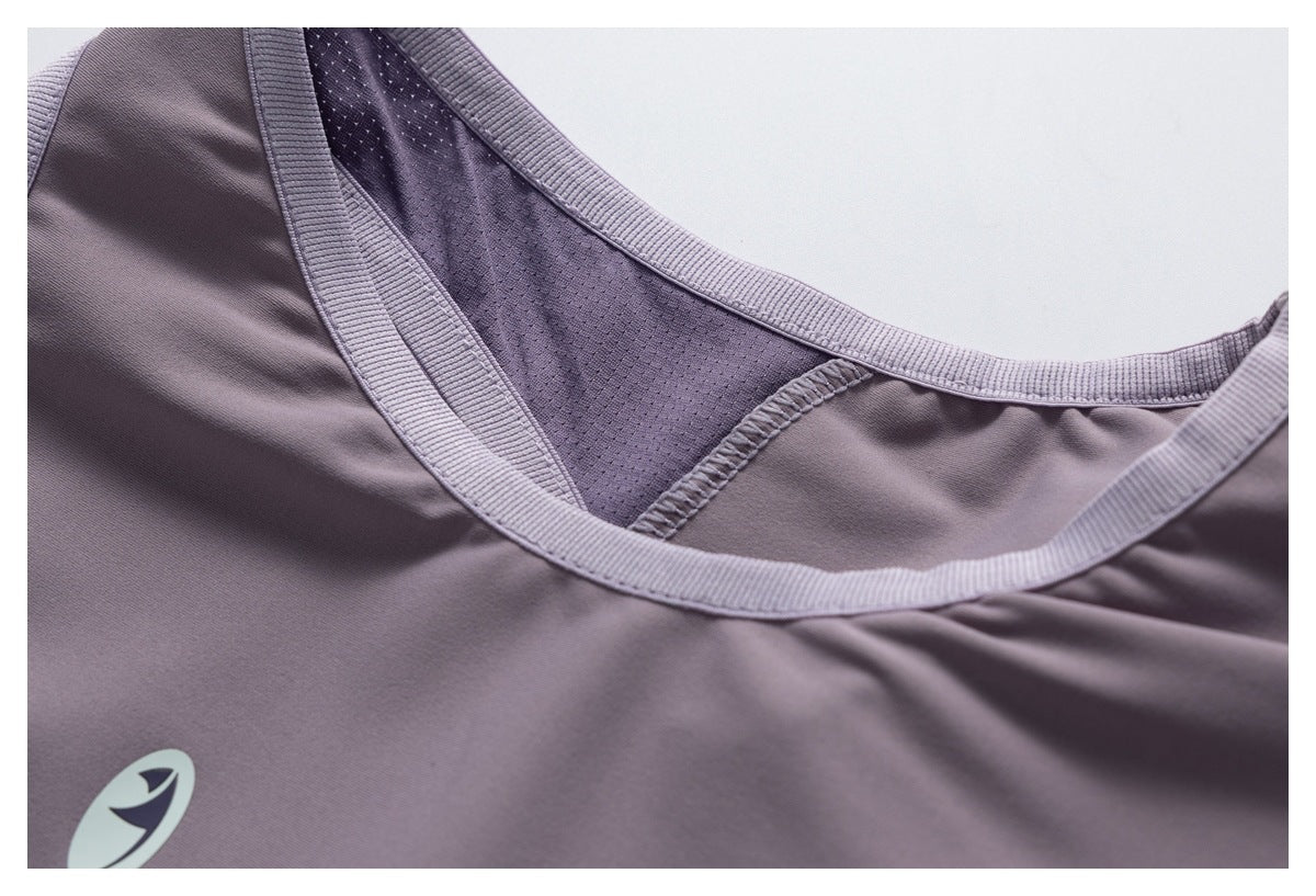 Close-up of the mauve top's neckline, ribbed binding, and perforated mesh panel.