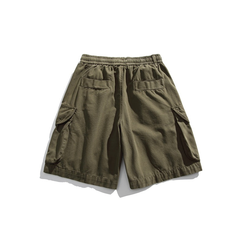 Back view of olive cargo shorts with an elastic waist, two rear pockets, and large flap cargo pockets.