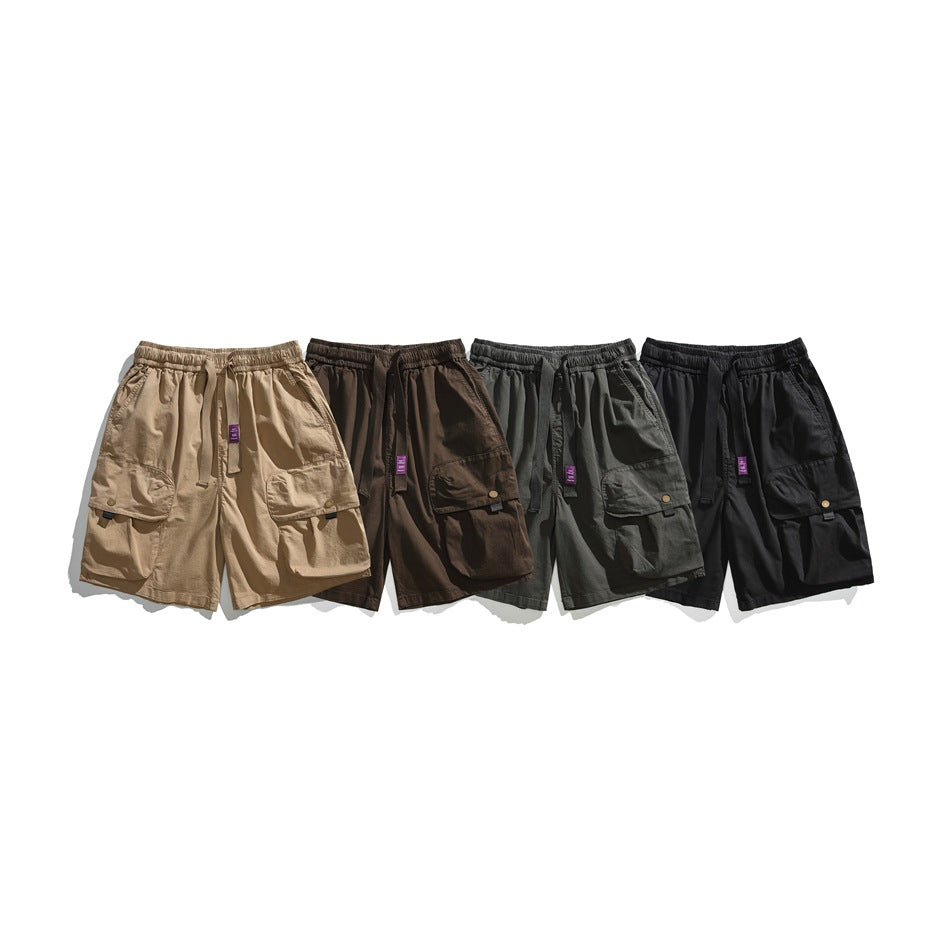 Four cargo shorts shown together in tan, brown, dark gray, and black, each with large flap pockets.