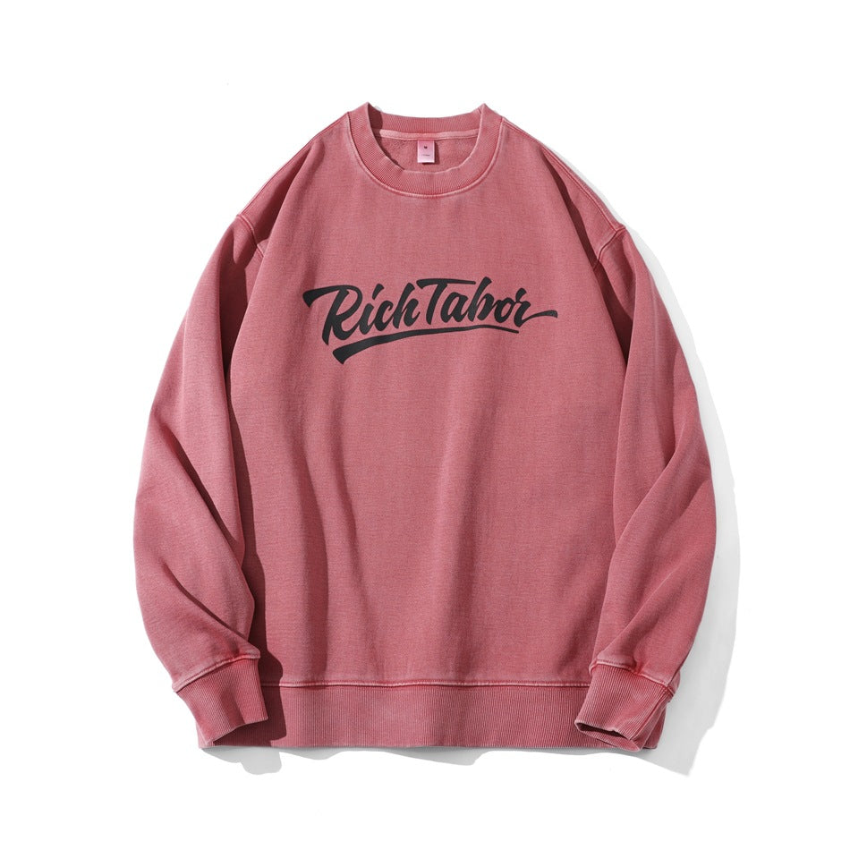 Watermelon red washed crew-neck sweatshirt with black script chest print, flat lay front view
