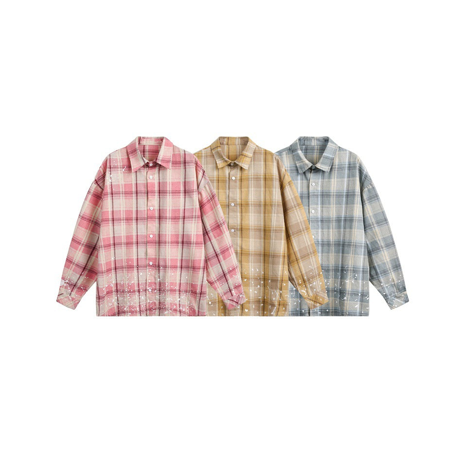 Three plaid button-up shirts shown side by side in pink, tan, and blue-gray, each with white splatter details.