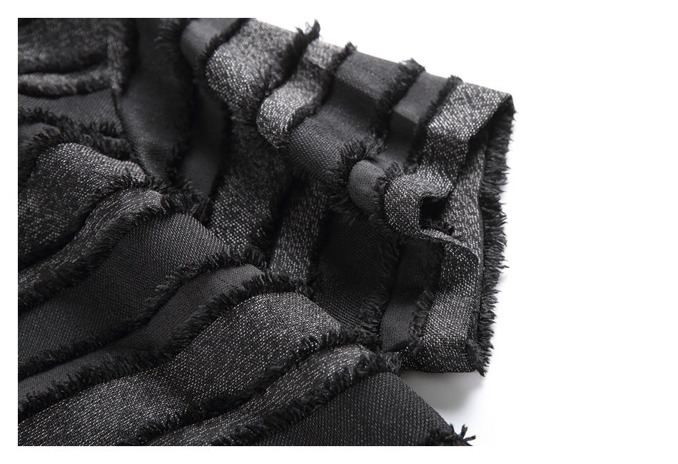 Close-up of the shirt's short sleeve, showing textured stripes and frayed edges.