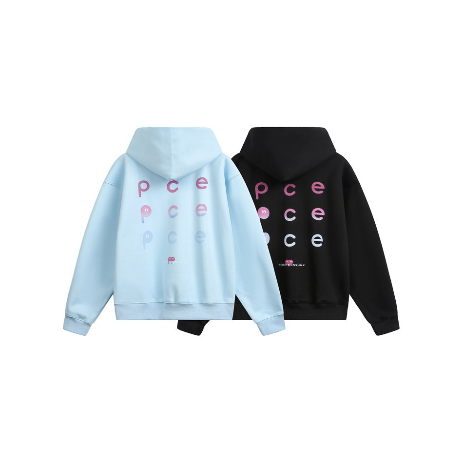 Back views of light blue and black hoodies with multicolored lettering arranged in rows.