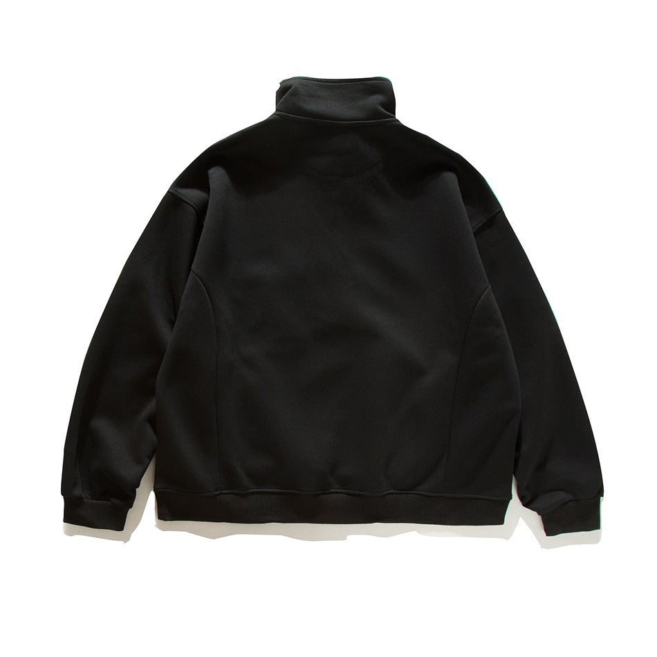Back view of a black high-collar sweatshirt with long sleeves and ribbed cuffs and hem.