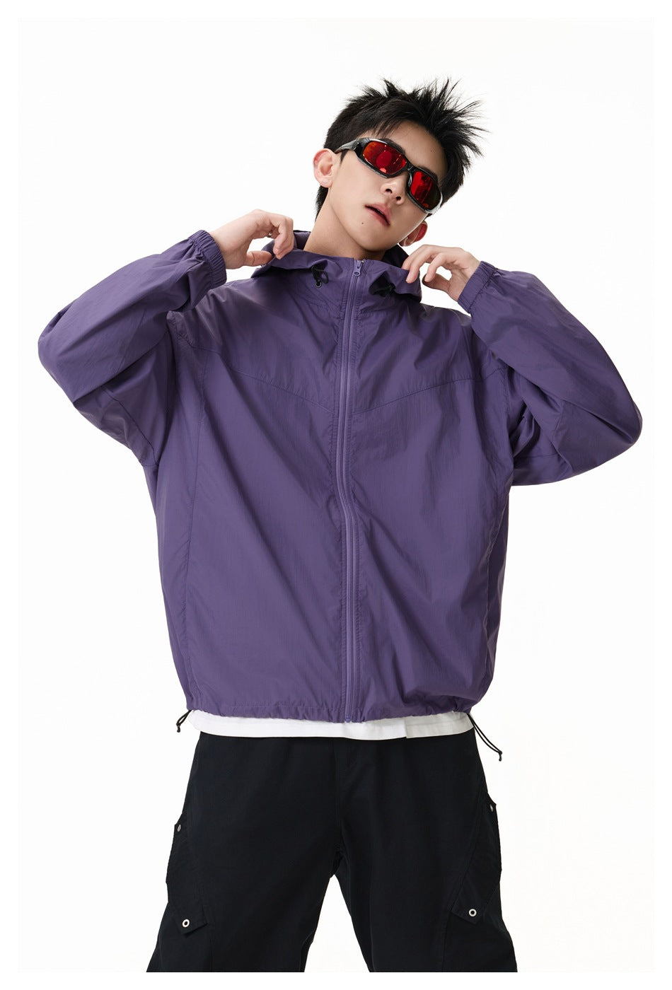 Model wearing a purple hooded zip jacket with drawcords, shown from the front against a white background.