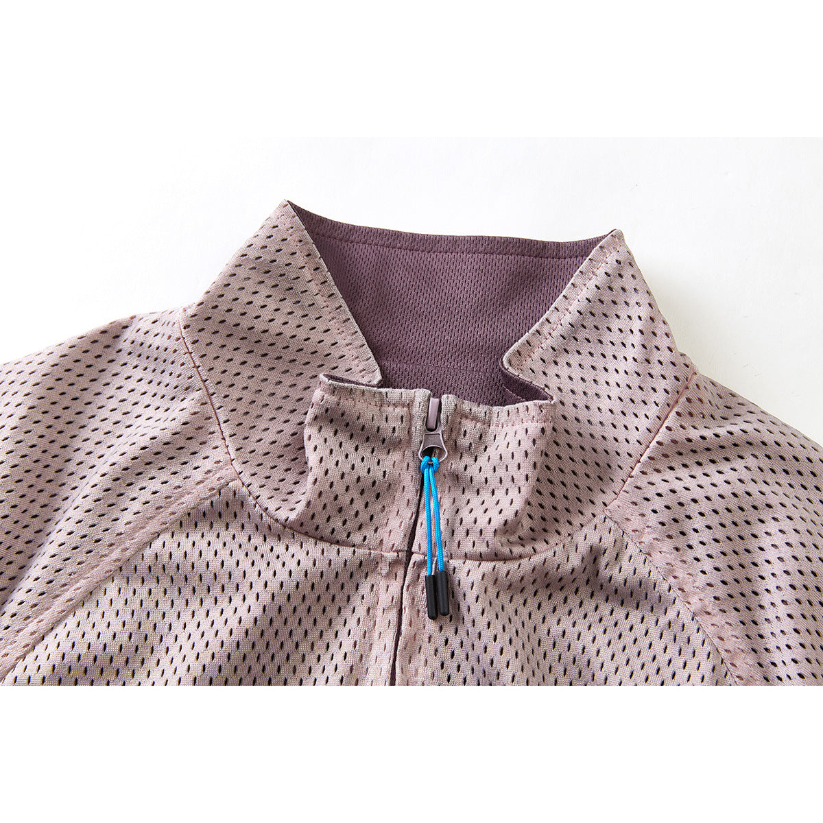 Close-up of a dusty mauve jacket collar and front zipper with a bright blue pull cord.