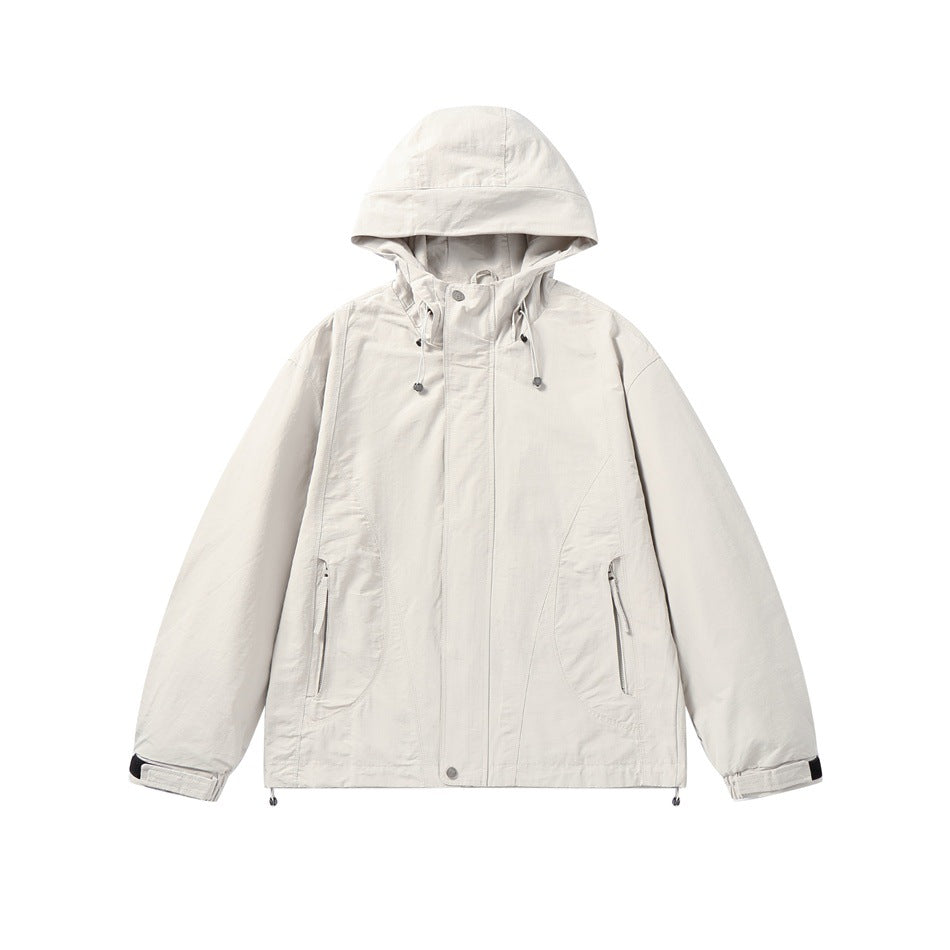 Beige hooded zip-front jacket with drawcord hood, zippered pockets and tab cuffs, flat lay front view