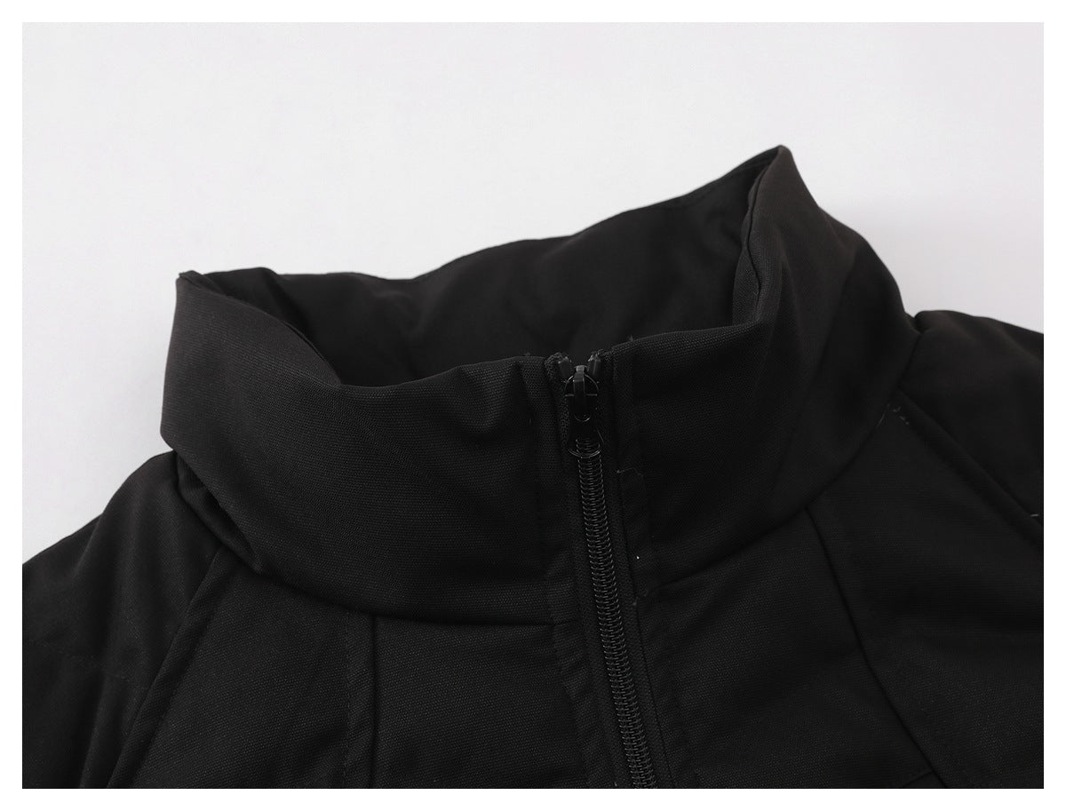 Close-up of a black jacket's high stand collar and front zipper.
