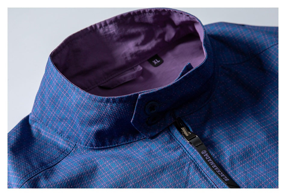 Close-up of a blue-and-purple patterned jacket collar, upper zipper, and inner XL label.