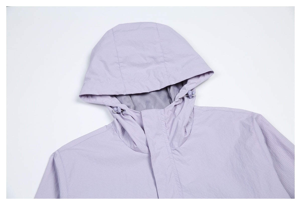 Close-up of the pale lavender jacket's hood, mesh lining, and adjustable drawcords.