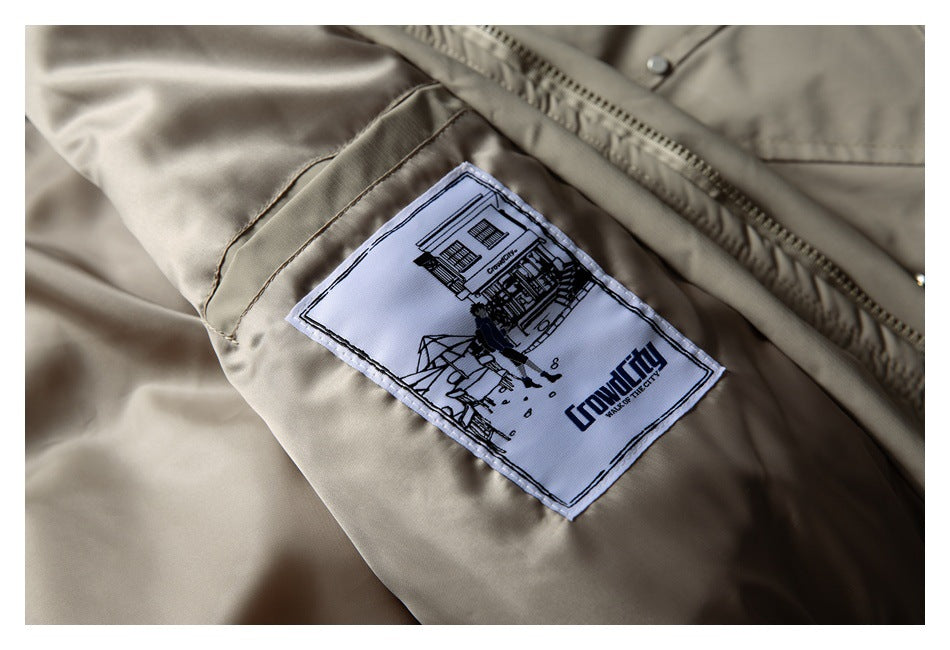 Close-up of a taupe jacket lining with a sewn-in illustrated label bearing English text.