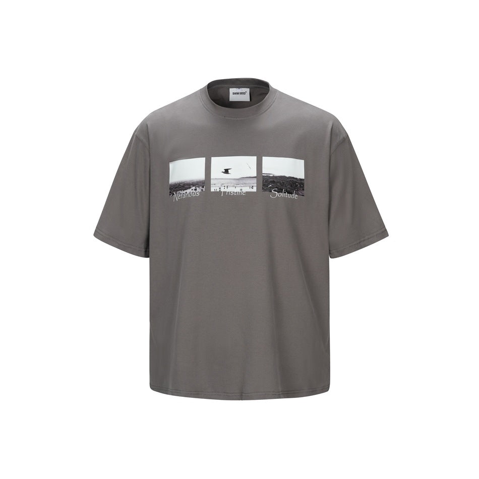 Gray short-sleeve crew neck T-shirt with a three-panel black-and-white photo print on the chest, front view