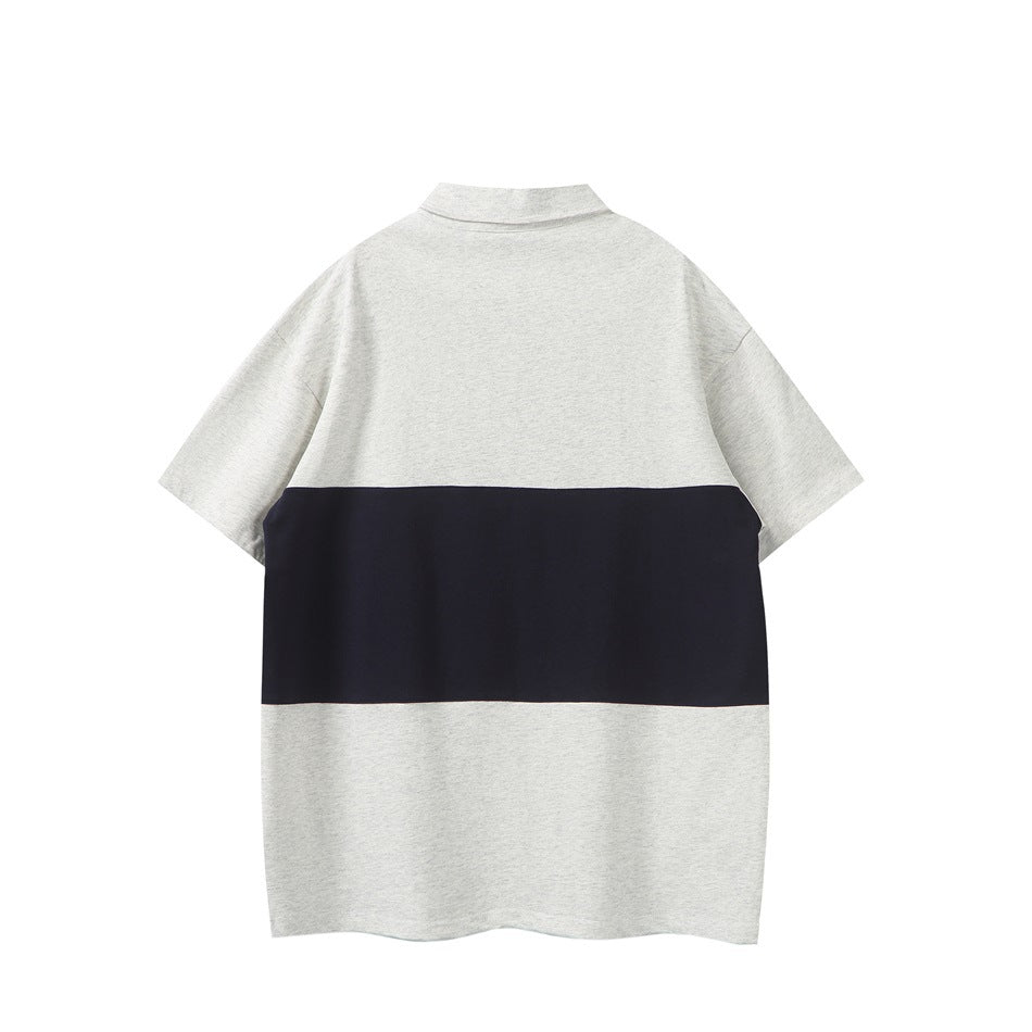 Back view of a light gray short-sleeve polo shirt with a wide navy horizontal band.