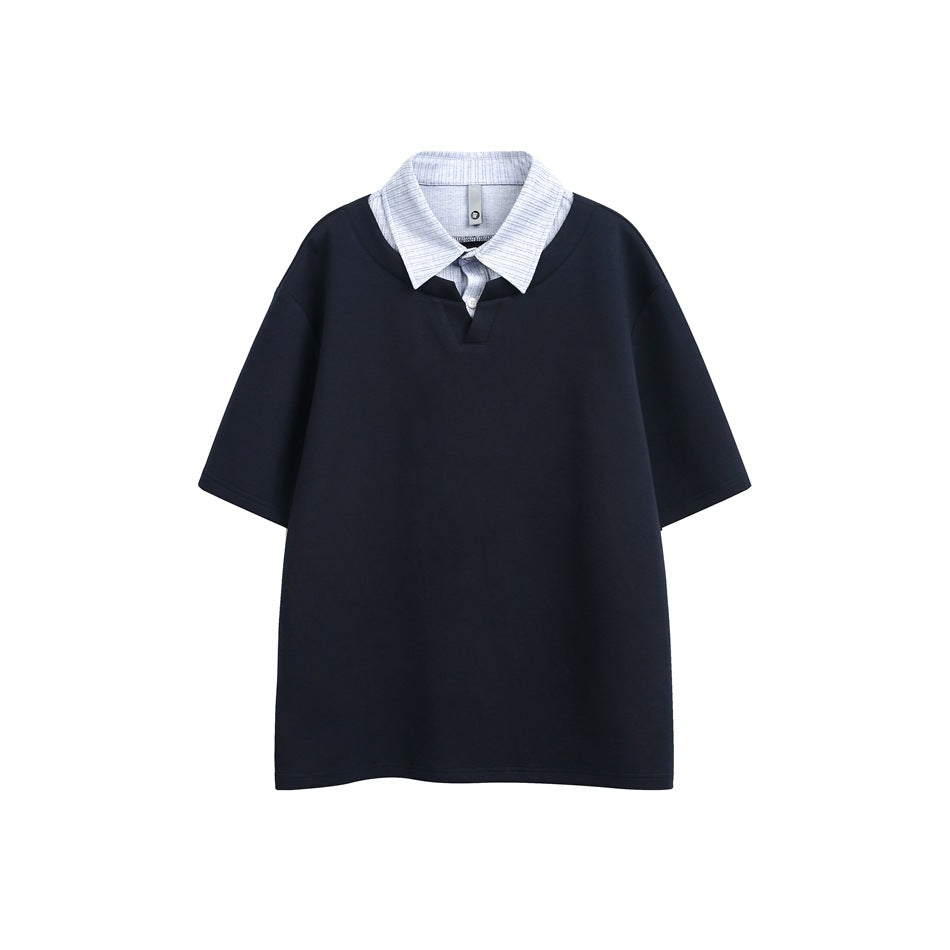 Navy short-sleeve top with a layered light blue striped shirt collar and button placket, flat front view