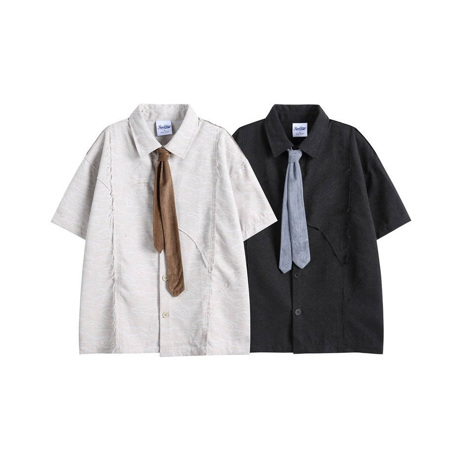 White and black short-sleeve collared shirts, each styled with a contrasting long tie.