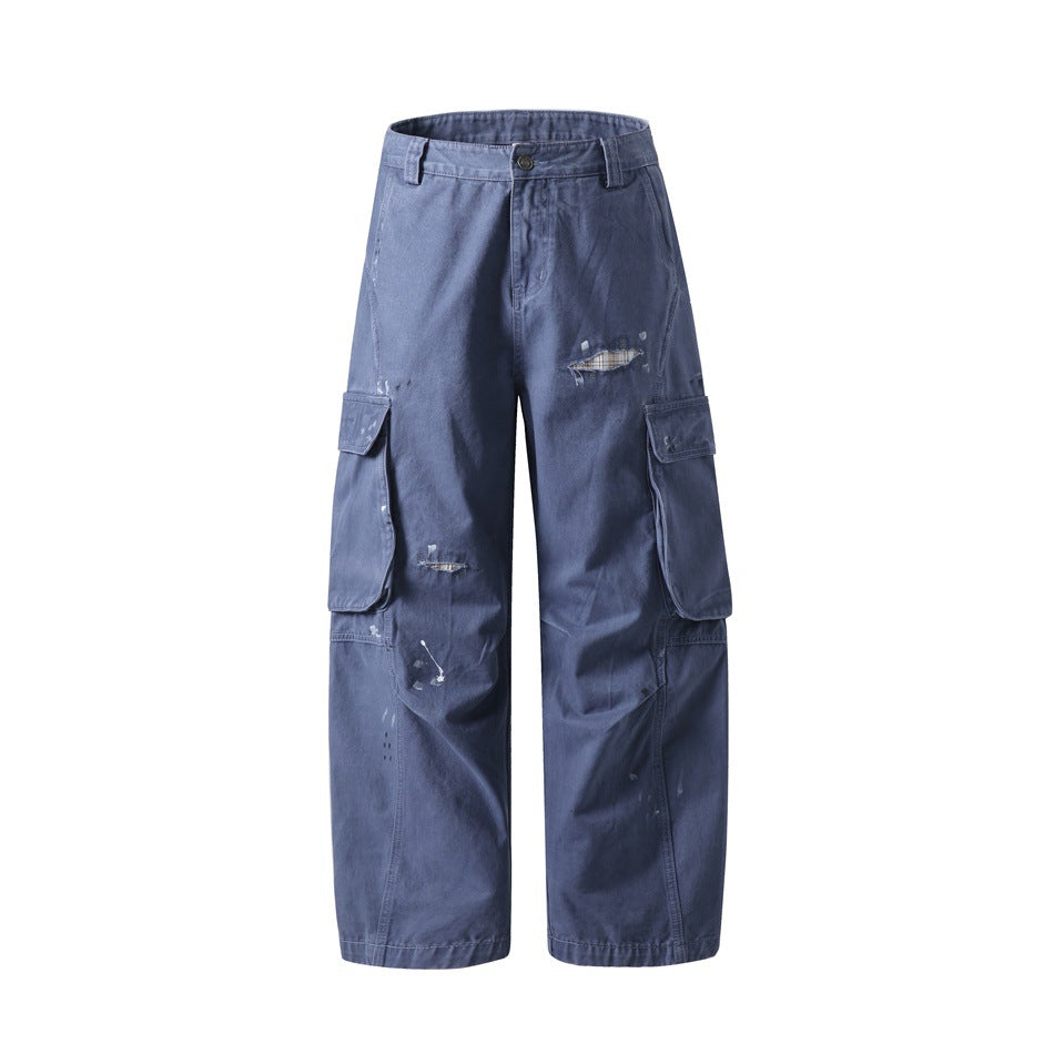 Navy blue washed wide-leg cargo pants with flap pockets and distressed knee holes, front flat view