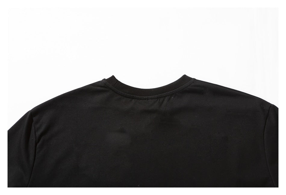 Close-up of the black shirt's crew neckline and shoulder seams.