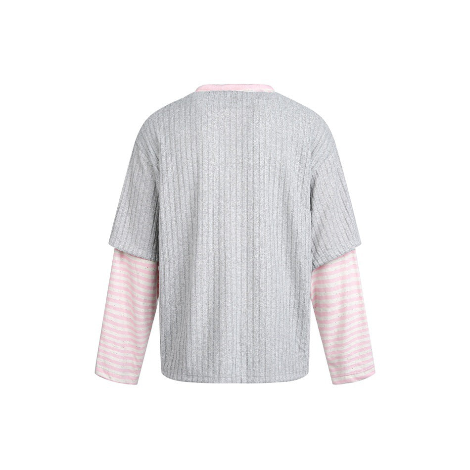 Back view of a gray ribbed short-sleeve top layered over pink-and-white striped long sleeves.