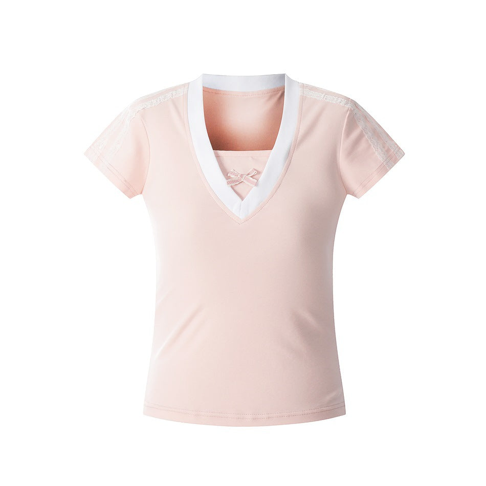 Pink short-sleeve V-neck top with white neckline band, small bow and lace shoulder trim, flat front view