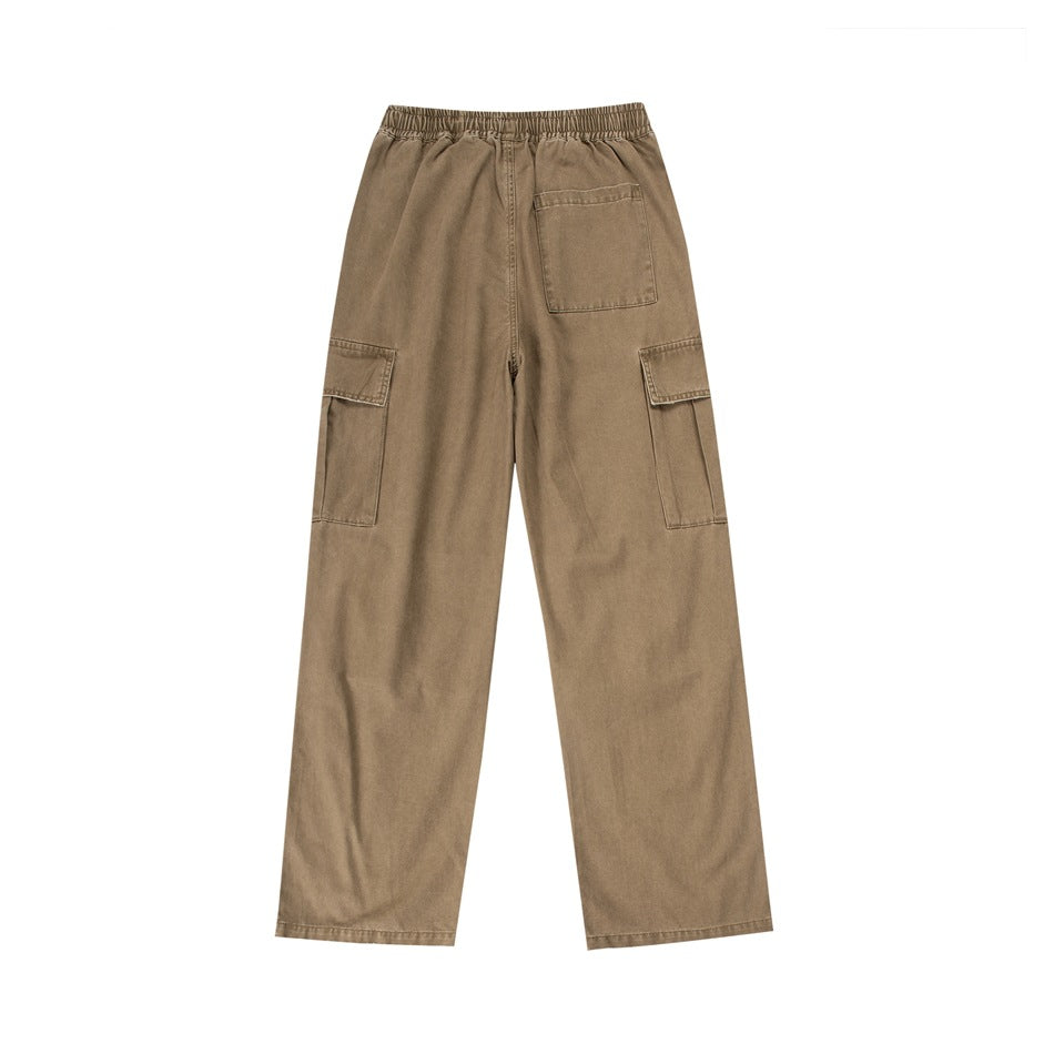 Rear view of tan wide-leg cargo pants with an elastic waist, one back patch pocket and flap cargo pockets.